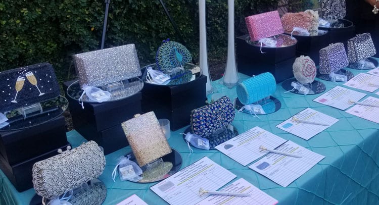 table full of Swarovski crystal elements purses in different sizes