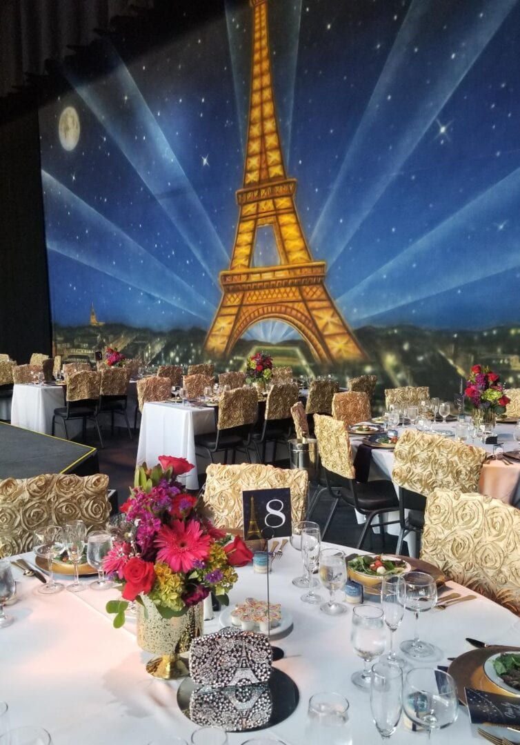event with round tables and Paris background