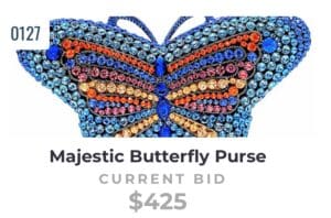 Colorful beaded butterfly purse with blue, orange, and pink hues.