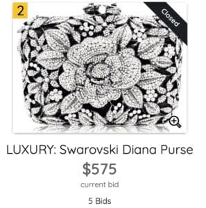 Intricately designed Swarovski Diana purse with floral motifs.
