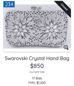 Elegant Swarovski crystal handbag priced at $850 with 17 bids.