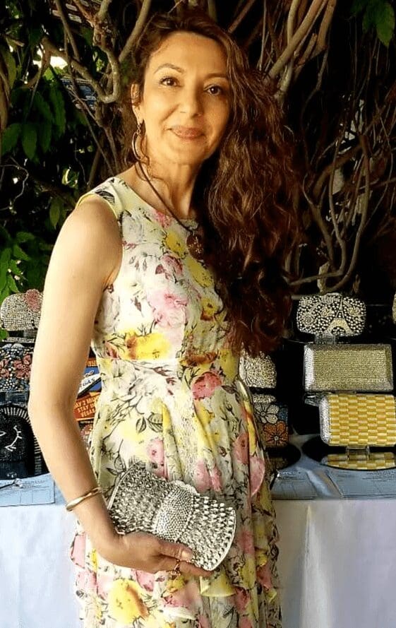 woman wearing dress with silver Swarovski crystal purse