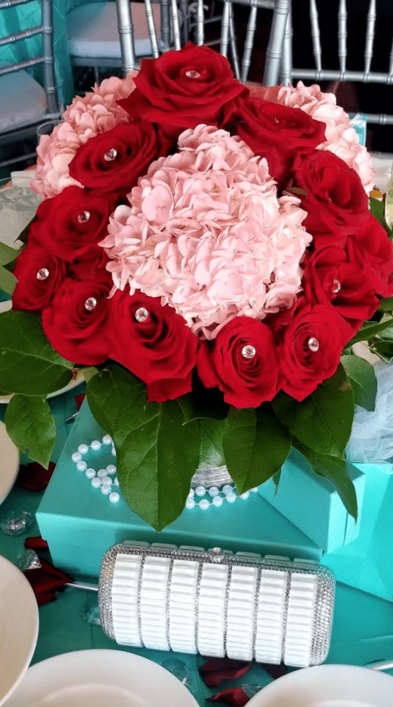 red and pink floral bouquet with Swarovski crystal purse