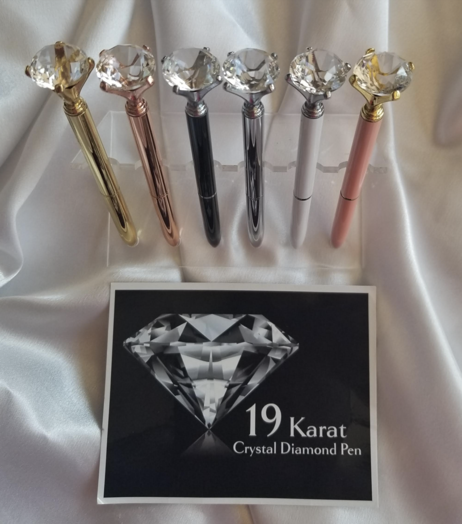display of 19 karat crystal diamond pens