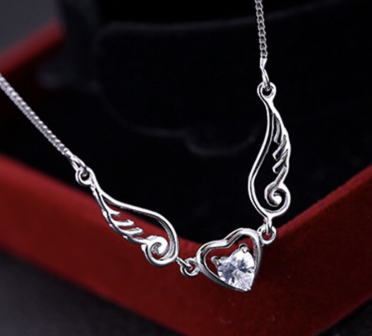 silver heart necklace with wings