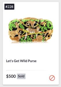 Leopard-print purse with green accents and gold chain strap.